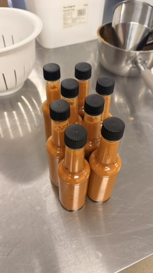 Eight bottles of freshly made hot sauce